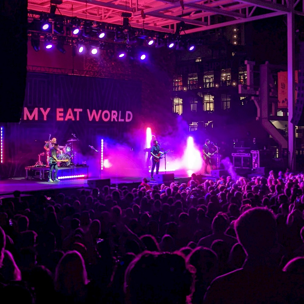 Jimmy Eat World performing with backdrop obscured so it looks like 'My Eat World'