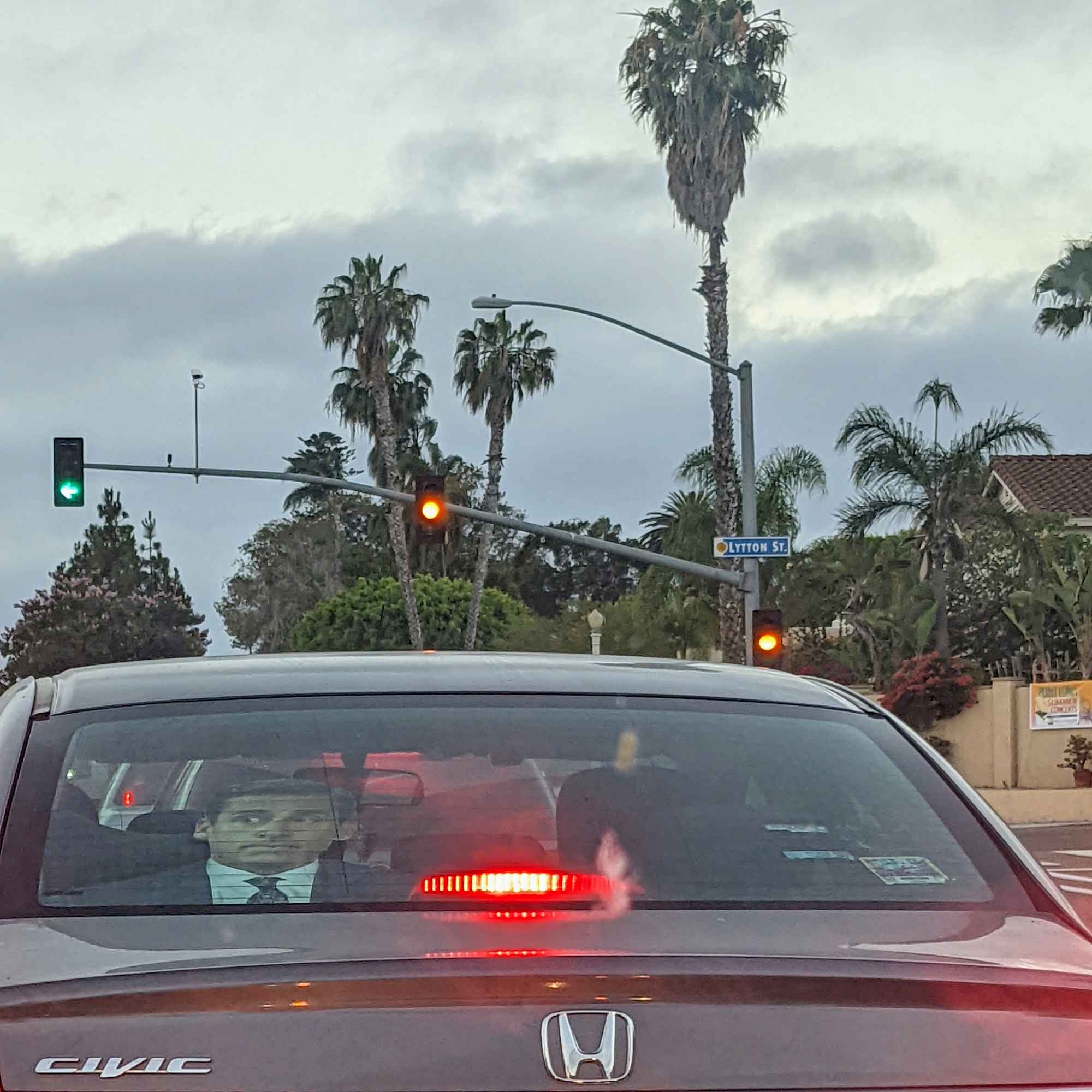 a window screen of character Michael Scott (The Office) in the rear window of a car