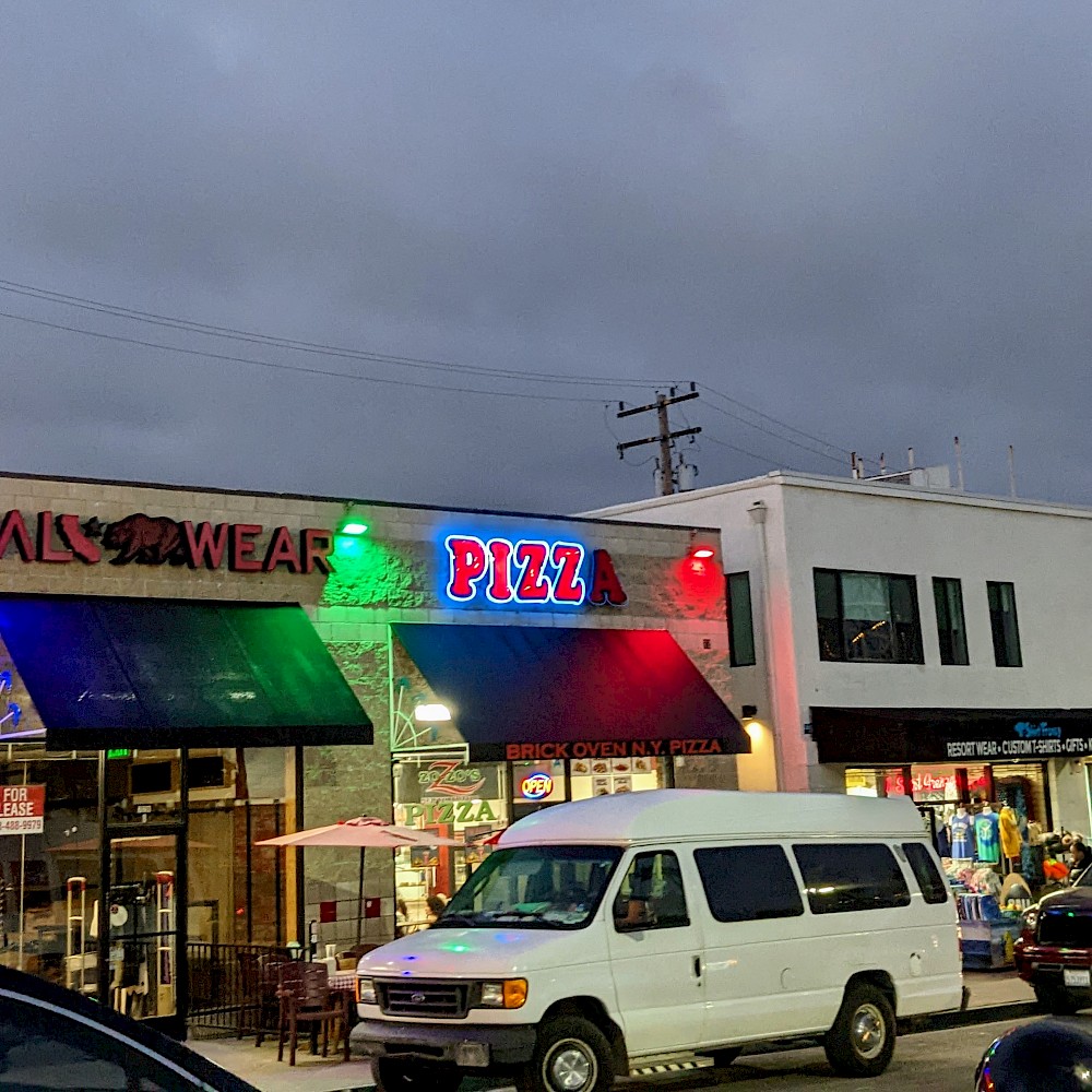 light up sign for 'pizza' with the 'a' not lit
