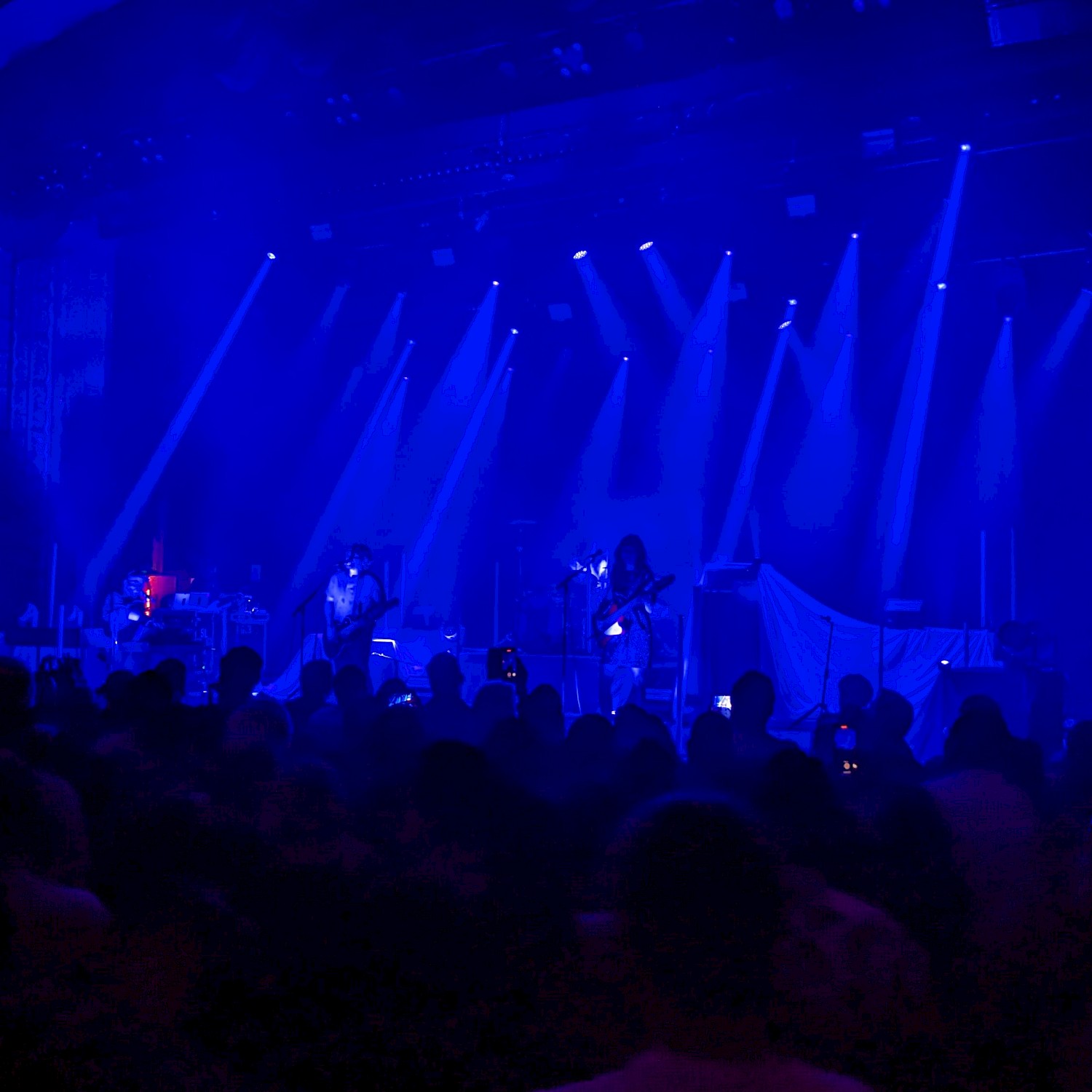Silversun Pickups on stage with blue lighting