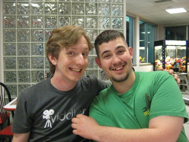 Me cheesing on the left, wearing a gray Viddler shirt, and Jon on the right wearing a green shirt