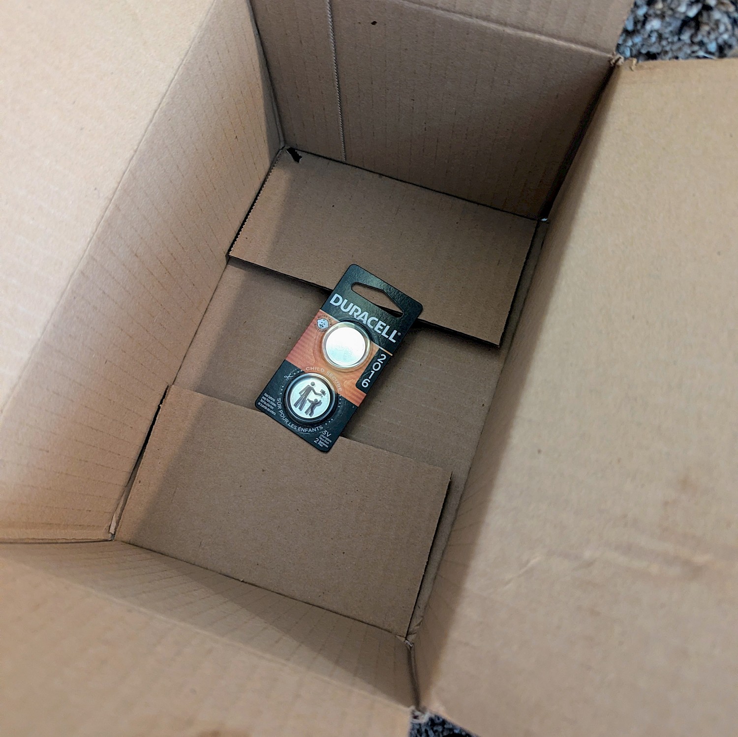 a box that is about 6 inches long, 4 inches wide, and 4 inches deep, with only a small Duracell battery package in it